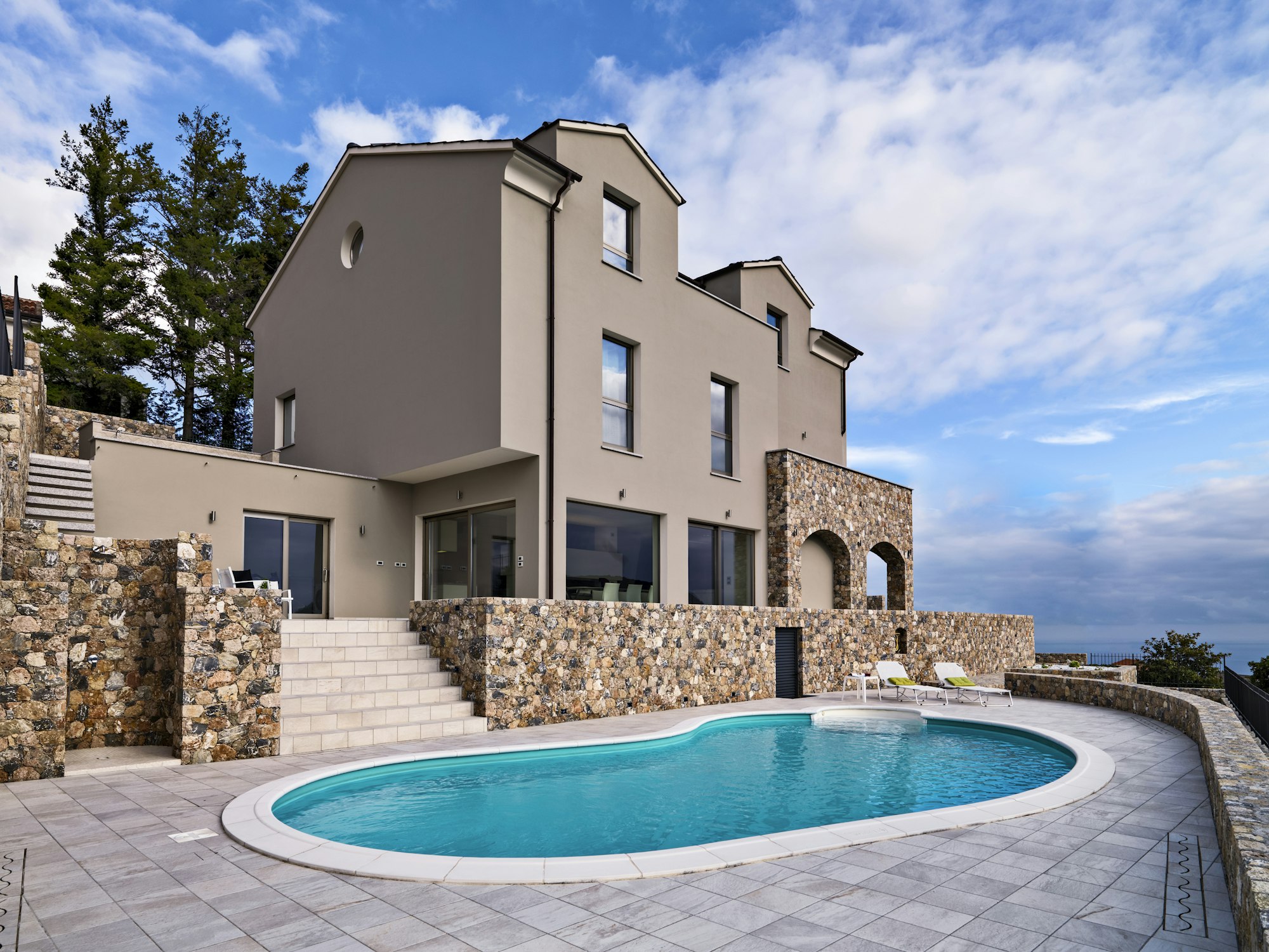exteriors-view-of-a-modern-villa-in-the-foreground-the-swimming-pool.jpg
