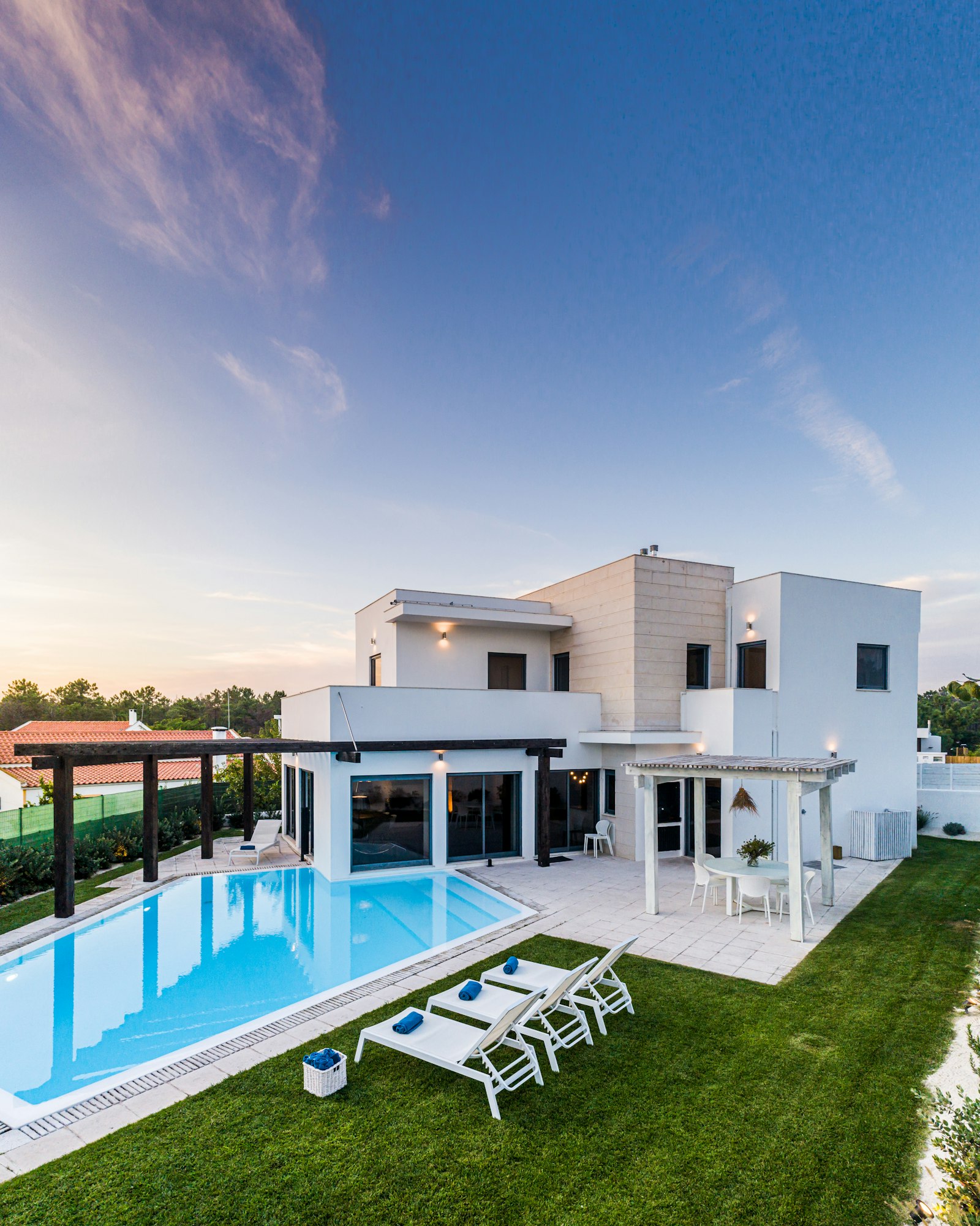 modern-house-with-garden-swimming-pool-and-wooden-pergula.jpg